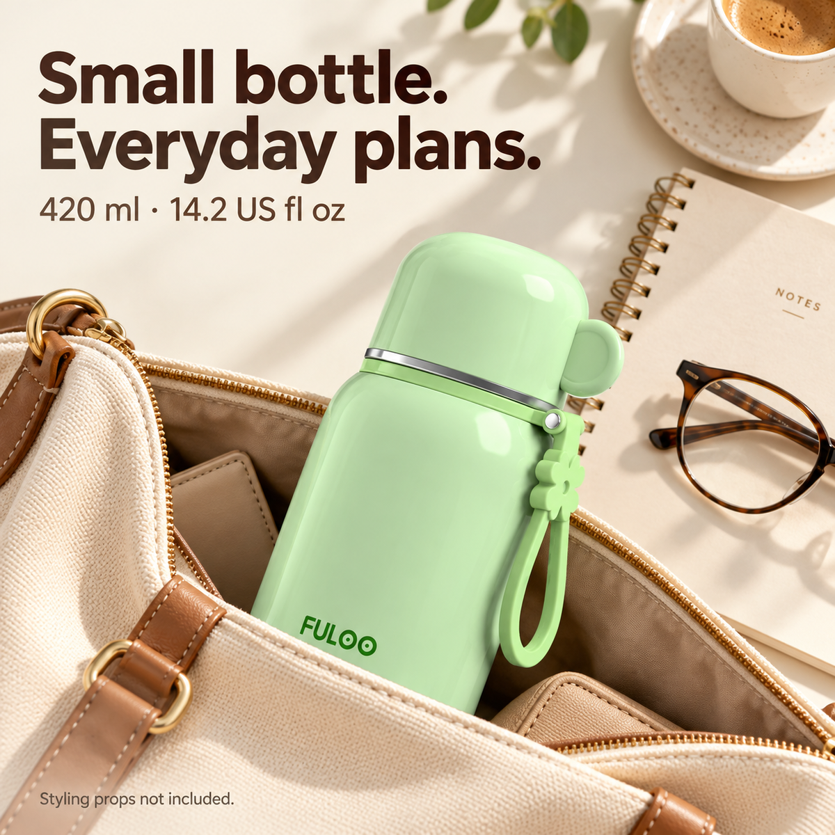 Mint Green FULOO 420 ml travel bottle in an everyday tote bag, showing its compact size and matching carry loop.